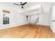 Open-concept living area with hardwood floors, decorative ceiling, and plenty of room for entertaining at 4060 Barton Park Pl, Raleigh, NC 27613