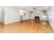 Bright living room with hardwood floors, a cozy fireplace, and access to the outdoor space at 4060 Barton Park Pl, Raleigh, NC 27613