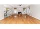 Spacious living room featuring hardwood floors, a fireplace, and large windows for natural light at 4060 Barton Park Pl, Raleigh, NC 27613