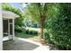 A view of the backyard from the patio, revealing a well maintained lawn and perimeter landscaping at 418 Byrams Ford Dr, Cary, NC 27513