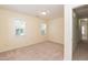 Bedroom featuring carpet, natural light from two windows, and neutral paint at 418 Byrams Ford Dr, Cary, NC 27513