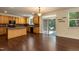 Eat-in kitchen features wood cabinets, a central island, and access to the backyard at 418 Byrams Ford Dr, Cary, NC 27513