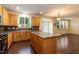 Spacious kitchen with wooden cabinets, tile backsplash, a center island, and great lighting at 418 Byrams Ford Dr, Cary, NC 27513