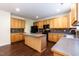Kitchen with a center island, tile backsplash, stainless steel appliances, and wood cabinets at 418 Byrams Ford Dr, Cary, NC 27513