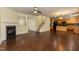 Open concept living room leading to the kitchen and staircase, hardwood floors throughout at 418 Byrams Ford Dr, Cary, NC 27513