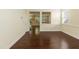 Bright room featuring hardwood floors, neutral paint, and an open layout with natural light at 418 Byrams Ford Dr, Cary, NC 27513