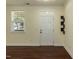 Bright living space with hardwood floors, natural lighting, and a side door leading to the exterior at 418 Byrams Ford Dr, Cary, NC 27513