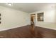 Open-concept living area with hardwood floors, neutral walls, and a spacious design at 418 Byrams Ford Dr, Cary, NC 27513