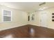 Well-lit area with hardwood floors, large windows, and a view of the front door and exterior at 418 Byrams Ford Dr, Cary, NC 27513