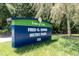 Entrance sign for Fred G. Bond Metro Park, with lush grass and shade trees at 418 Byrams Ford Dr, Cary, NC 27513