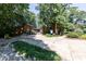 Park building featuring a timber frame design surrounded by lush trees and vegetation at 418 Byrams Ford Dr, Cary, NC 27513