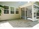 Paved patio area leading to a screened-in porch with access to the home's interior at 418 Byrams Ford Dr, Cary, NC 27513