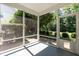 Screened-in porch with access to the backyard's lush greenery and a convenient pet door at 418 Byrams Ford Dr, Cary, NC 27513