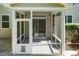 Covered screened-in porch providing a relaxing transition from indoors to the outdoors at 418 Byrams Ford Dr, Cary, NC 27513