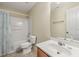 Bright bathroom with a tub shower, single sink vanity, and tile flooring at 4205 Twin Spires Dr, Knightdale, NC 27545