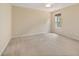 Spacious bedroom features neutral carpet, bright windows, and ceiling fan at 4205 Twin Spires Dr, Knightdale, NC 27545