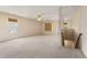 Spacious bonus room with neutral carpet, bright windows, and ceiling fan at 4205 Twin Spires Dr, Knightdale, NC 27545
