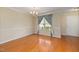 Elegant dining room with hardwood floors, decorative trim, and a stylish chandelier at 4205 Twin Spires Dr, Knightdale, NC 27545