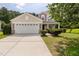 Charming home with a two-car garage, manicured landscaping, and a welcoming front porch at 4205 Twin Spires Dr, Knightdale, NC 27545