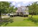 Inviting two-story home featuring a well-maintained lawn and classic architectural details at 4205 Twin Spires Dr, Knightdale, NC 27545