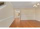 Open hallway with hardwood floors, archway, and bright neutral paint at 4205 Twin Spires Dr, Knightdale, NC 27545