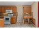 Functional kitchen with wooden cabinets, modern appliances, and convenient storage features at 4205 Twin Spires Dr, Knightdale, NC 27545