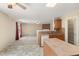 Open kitchen view to living room features an island, tile backsplash, and modern appliances at 4205 Twin Spires Dr, Knightdale, NC 27545