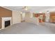 Spacious living room with a cozy fireplace, carpeted floors, and ample natural light at 4205 Twin Spires Dr, Knightdale, NC 27545