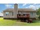 Expansive backyard with green lawn, established trees and deck, providing great outdoor space at 432 Barn View Ct, Fuquay Varina, NC 27526