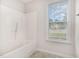 Bathroom featuring a shower and window at 432 Barn View Ct, Fuquay Varina, NC 27526
