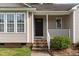 Close-up view of the home's entrance, featuring a quaint porch and stylish front door at 432 Barn View Ct, Fuquay Varina, NC 27526