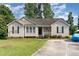 Inviting single-story home with neat landscaping and a comfortable front entrance at 432 Barn View Ct, Fuquay Varina, NC 27526