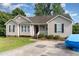 Attractive single-story home featuring a cozy front porch and a convenient driveway at 432 Barn View Ct, Fuquay Varina, NC 27526