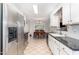 Efficient kitchen featuring stainless steel appliances, granite countertops, and a view of the dining area at 432 Barn View Ct, Fuquay Varina, NC 27526