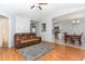Open-concept living area connecting to the kitchen, featuring hardwood floors and neutral paint at 432 Barn View Ct, Fuquay Varina, NC 27526