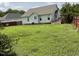 Spacious backyard with a deck and a lush green lawn, perfect for outdoor entertaining at 44 Glen Meadow Dr, Angier, NC 27501