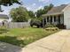 Beautifully landscaped front yard featuring a lush green lawn and charming curb appeal at 44 Glen Meadow Dr, Angier, NC 27501
