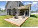 Backyard featuring a stone patio and covered area at 4505 Wingate Song Ct, Knightdale, NC 27545