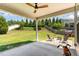 Large backyard with covered patio seating area and manicured lawn at 4505 Wingate Song Ct, Knightdale, NC 27545