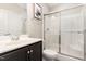 Bright bathroom with a glass shower, vanity, and neutral walls at 4505 Wingate Song Ct, Knightdale, NC 27545