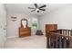 Bright bedroom featuring wooden furniture and a ceiling fan at 4505 Wingate Song Ct, Knightdale, NC 27545