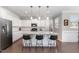 Modern kitchen features white cabinets, stainless steel appliances, granite countertops, and a center island at 4505 Wingate Song Ct, Knightdale, NC 27545