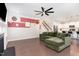 Stylish living room featuring a fireplace, ceiling fan, hardwood floors and open staircase at 4505 Wingate Song Ct, Knightdale, NC 27545