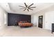 Spacious bedroom boasts a tray ceiling, fan, and colorful bedding at 4505 Wingate Song Ct, Knightdale, NC 27545