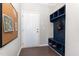 Mud room features built-in blue storage cubbies, hooks, and a bench at 4505 Wingate Song Ct, Knightdale, NC 27545