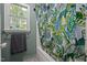 Bathroom showcasing a vibrant shower curtain and a window with natural light at 472 Shawnee Dr, Louisburg, NC 27549