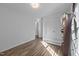 Bright bedroom featuring hardwood floors, closet storage, and natural light at 472 Shawnee Dr, Louisburg, NC 27549