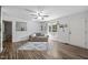Bright living room with cozy seating, natural lighting, and wood-look floors at 472 Shawnee Dr, Louisburg, NC 27549