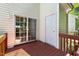 Wooden back deck with a sliding glass door entry to the home at 4802 Parkville Dr, Raleigh, NC 27604