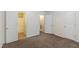 Spacious bedroom with neutral carpeting and an ensuite bathroom; perfect for relaxation at 4802 Parkville Dr, Raleigh, NC 27604